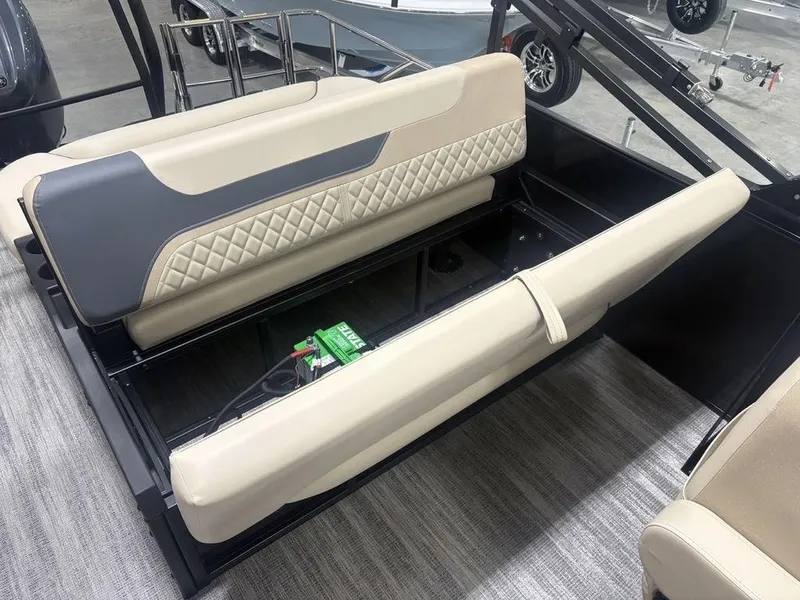 Slide: The Image of 2025 Godfrey Sweetwater 2286 SFLC boat seating with storage, featuring beige and gray upholstery. - 35