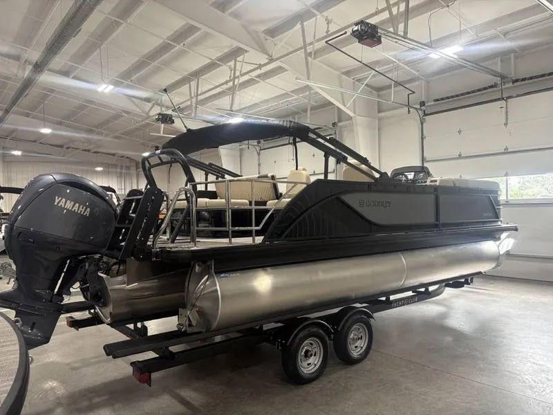 Slide: The Image of 2025 Godfrey Sweetwater 2286 SFLC pontoon boat with Yamaha engine in a showroom. - 5