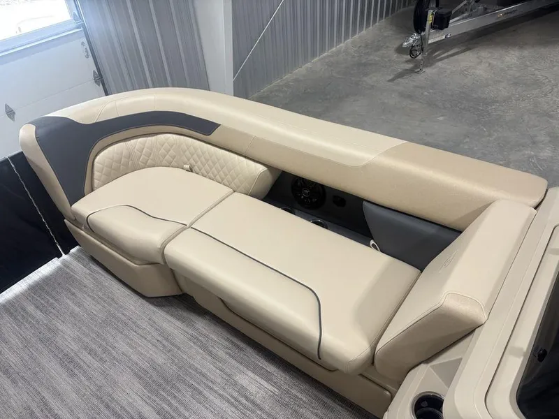 Slide: The Image of Luxurious seating on 2025 Godfrey Sweetwater 2286 SFLC pontoon boat, featuring elegant beige upholstery. - 8