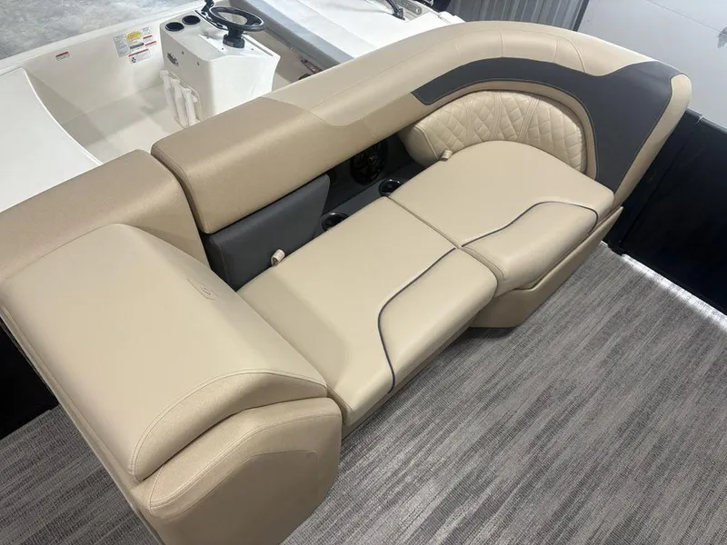 Slide: The Image of Luxurious seating on 2025 Godfrey Sweetwater 2286 SFLC pontoon boat, featuring elegant beige upholstery. - 9