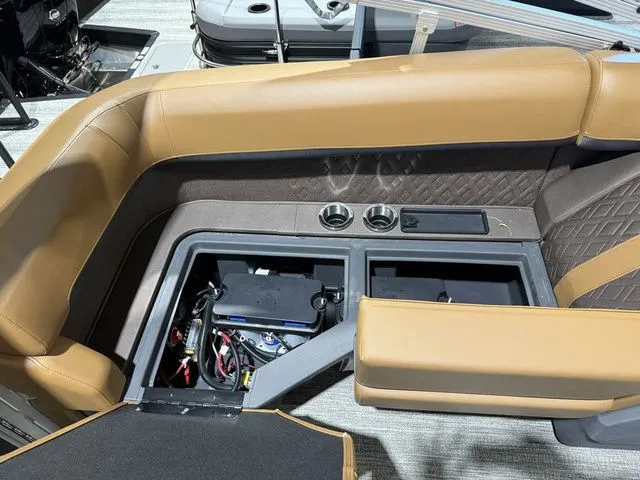 Slide: The Image of Interior of 2026 Bennington M Quad Bench 24 MFB Tritoon with storage compartments. - 27