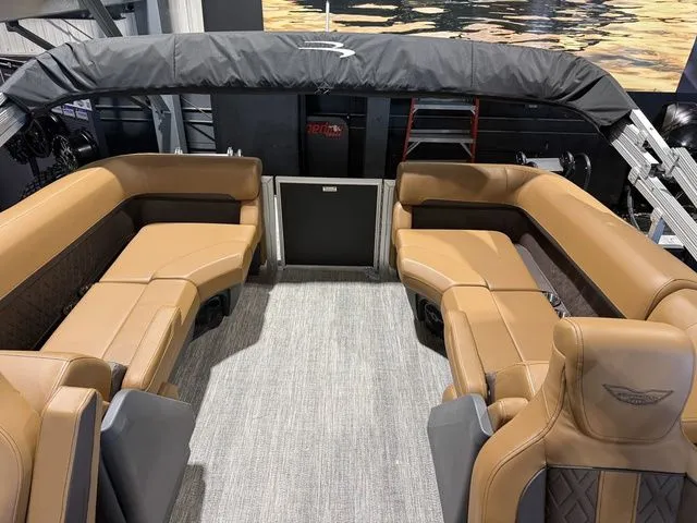 Slide: The Image of Interior of 2026 Bennington M Quad Bench 24 MFB Tritoon with luxurious seating. - 23
