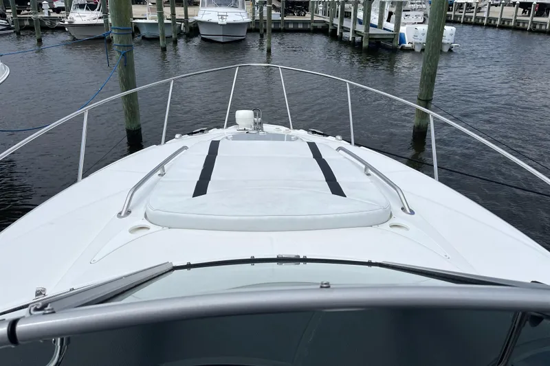 Slide: The Image of 2016 Monterey 295 Sport Yacht docked at marina, view from bow. - 21