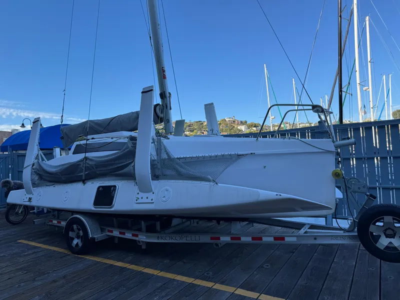 Slide: The Image of 2018 Corsair 760 Sport sailboat on trailer at marina dock. - 4