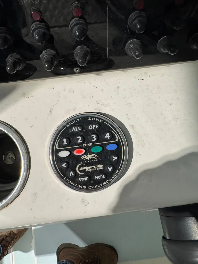 Slide: The Image of Control panel of 2023 Calypso Center Console with multi-zone lighting controller. - 15