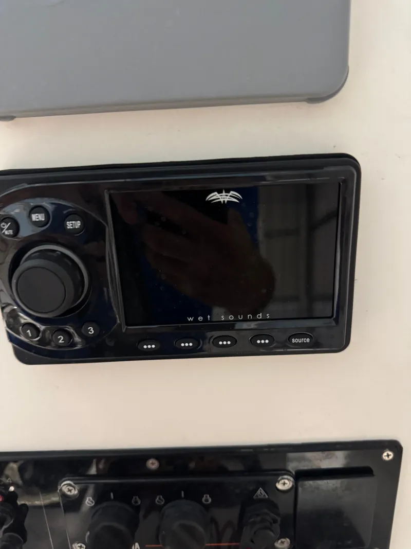 Slide: The Image of 2023 Calypso Center Console audio system with Wet Sounds control panel. - 16