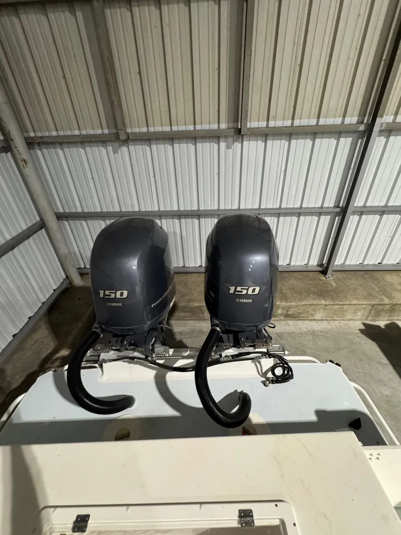 Slide: The Image of Twin Yamaha 150 outboard motors on a 2023 Calypso Center Console boat. - 21