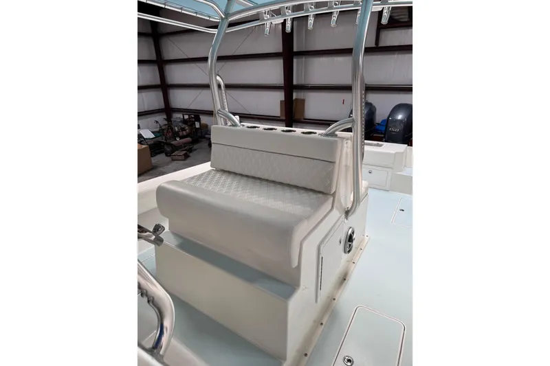 Slide: The Image of 2023 Calypso Center Console boat interior with cushioned seating and rod holders. - 27