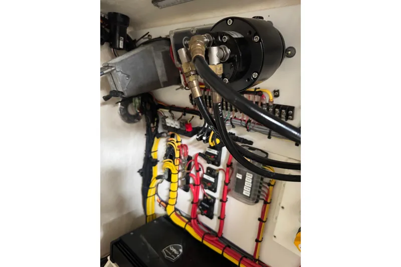 Slide: The Image of 2023 Calypso Center Console boat wiring and hydraulic system close-up. - 29