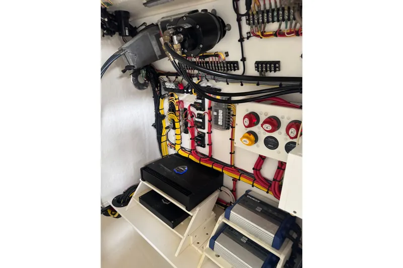 Slide: The Image of 2023 Calypso Center Console boat electrical system with organized wiring and components. - 32