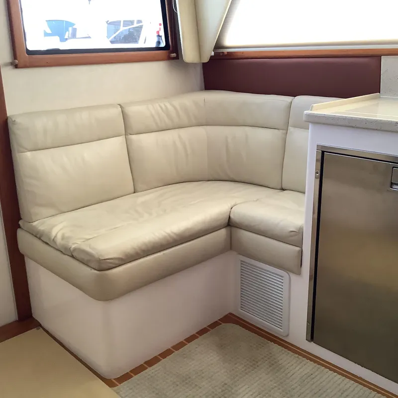 Slide: The Image of Luxurious interior of 2006 Cabo 35 Flybridge Sportfisher with cream leather seating. - 15