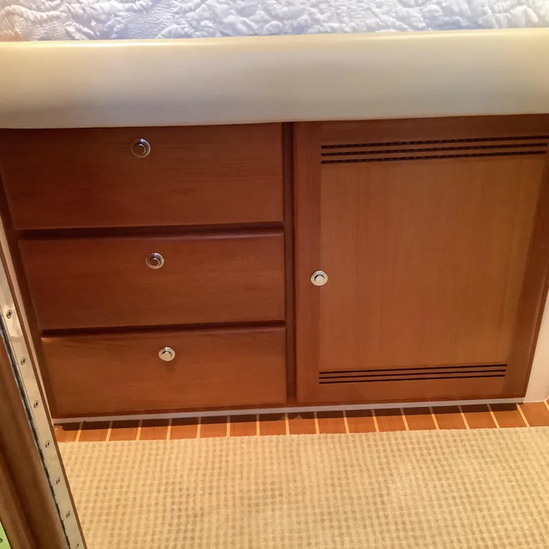 Slide: The Image of Wooden cabinetry in 2006 Cabo 35 Flybridge Sportfisher boat interior. - 32