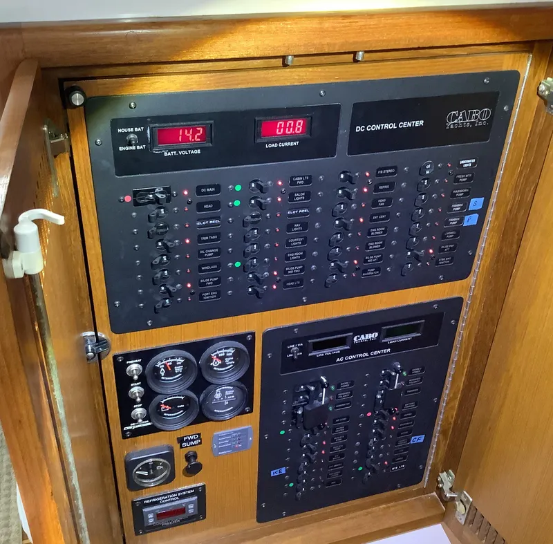 Slide: The Image of Electrical control panel of a 2006 Cabo 35 Flybridge Sportfisher boat. - 34