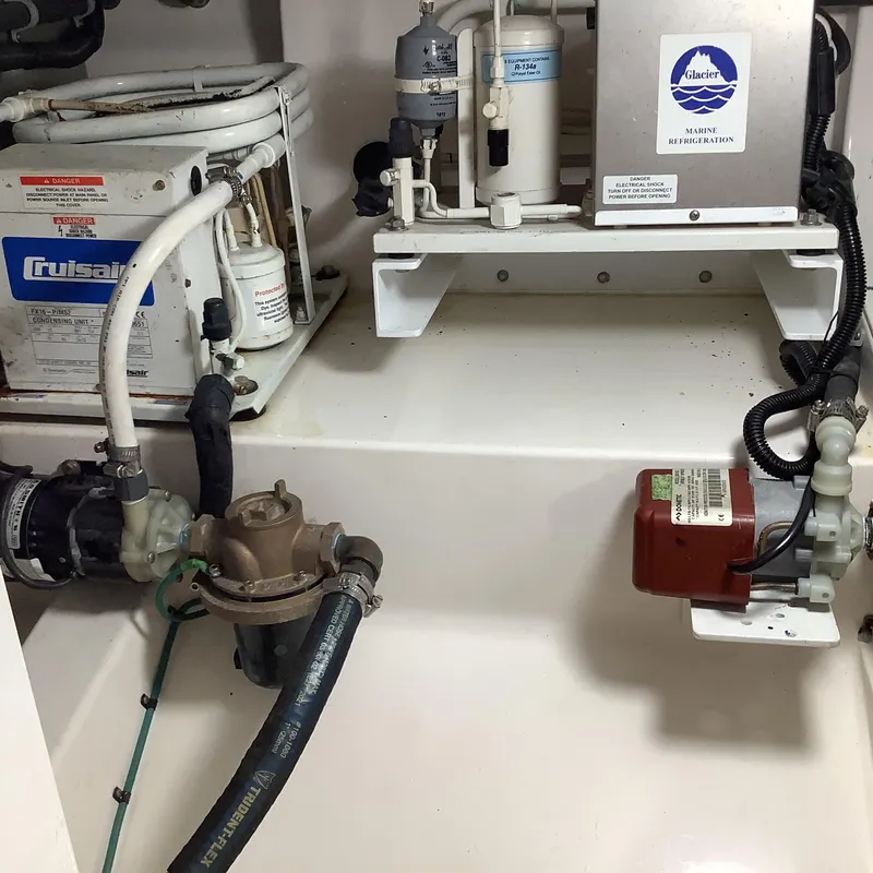 Slide: The Image of Engine room of 2006 Cabo 35 Flybridge Sportfisher with marine refrigeration and cooling systems. - 35