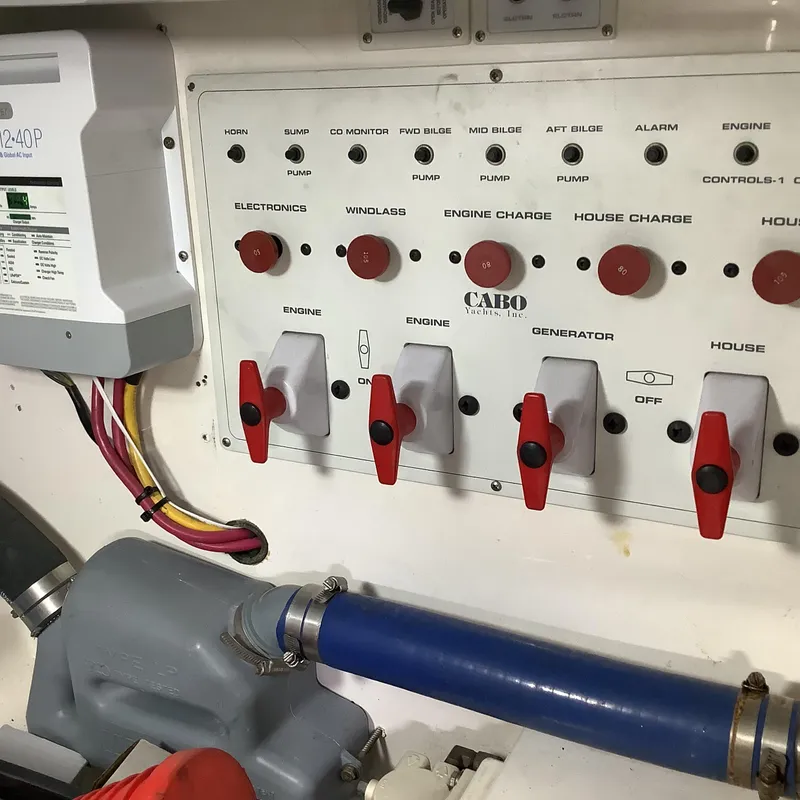 Slide: The Image of Electrical control panel of a 2006 Cabo 35 Flybridge Sportfisher boat. - 37