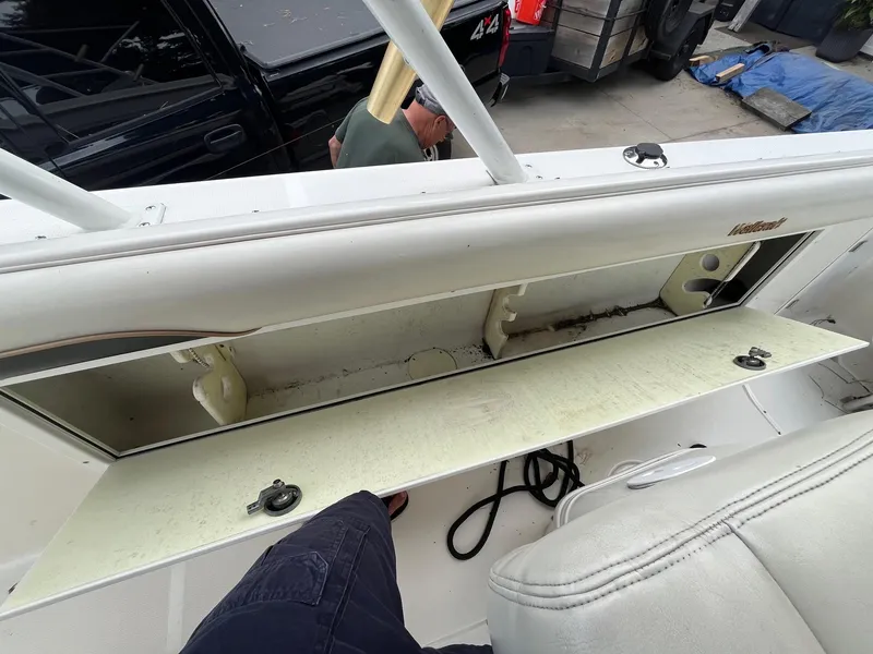Slide: The Image of Open storage compartment on a 2000 Wellcraft 302 SCARAB SPORT boat. - 22
