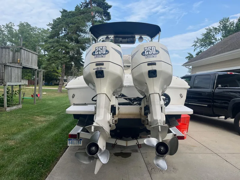 Slide: The Image of 2000 Wellcraft 302 SCARAB SPORT with twin 250 Ocean Pro engines on a driveway. - 7