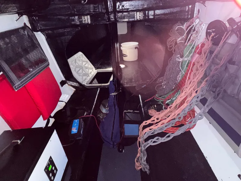 Slide: The Image of Interior of a 2015 Marstrom Seacart 30 sailboat with ropes and equipment. - 3