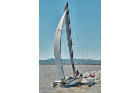Slide: The Image of Sailing on a Marstrom Seacart 30, 2005 model, under clear skies. - 7