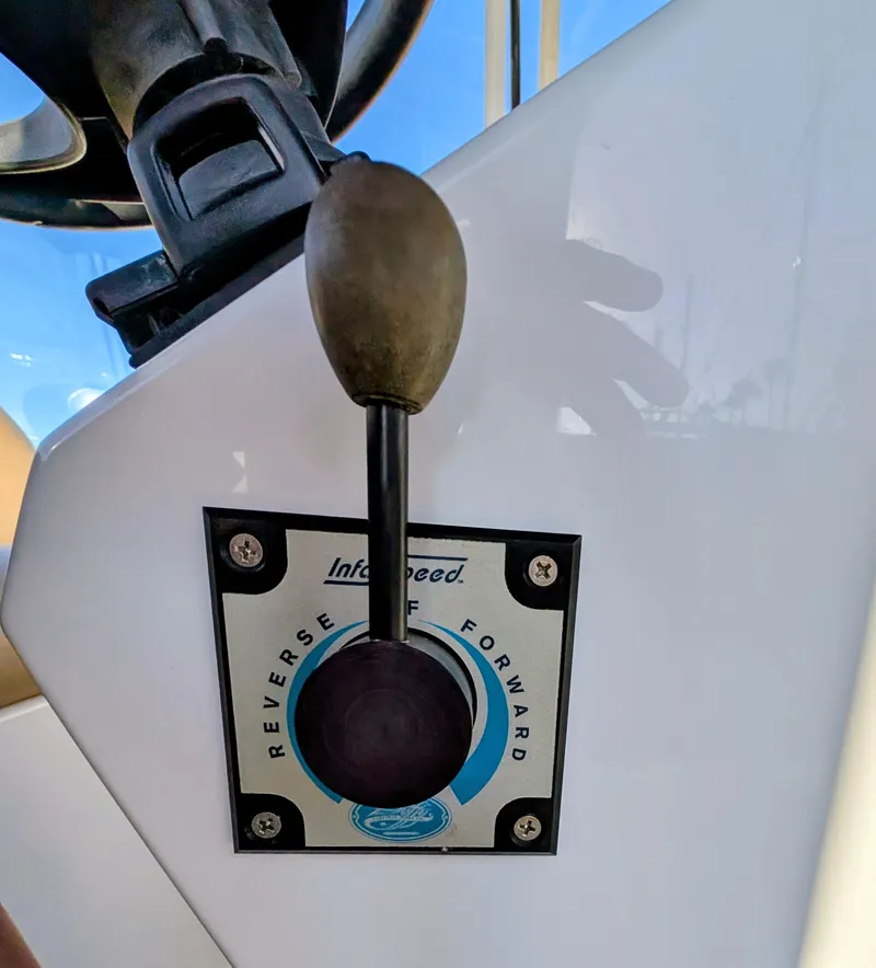 Slide: The Image of Throttle control lever on a 2004 Duffy 21 boat, showing reverse and forward options. - 7