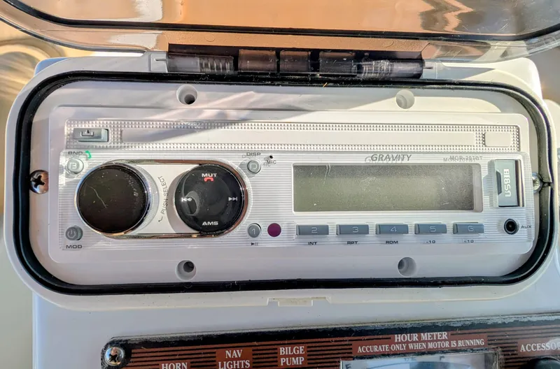 Slide: The Image of Control panel of a 2004 Duffy 21 boat featuring a Gravity audio system. - 8