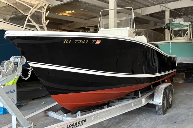 The Image of 2005 Regulator 24 Classic boat on trailer in storage facility. - 1