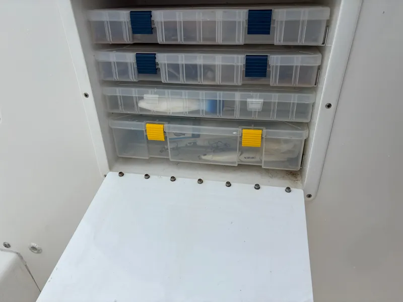 Slide: The Image of Tackle storage compartments on a 2005 Regulator 24 Classic boat. - 18