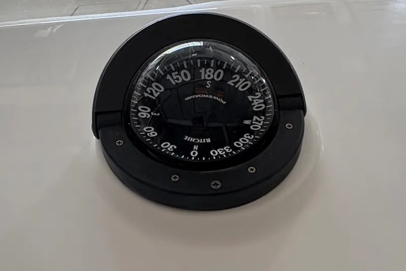 Slide: The Image of Compass on 2005 Regulator 24 Classic boat dashboard. - 19