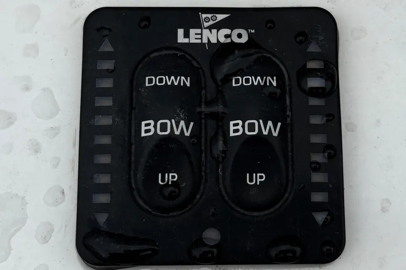 Slide: The Image of Lenco trim tab control panel on 2005 Regulator 24 Classic boat. - 23