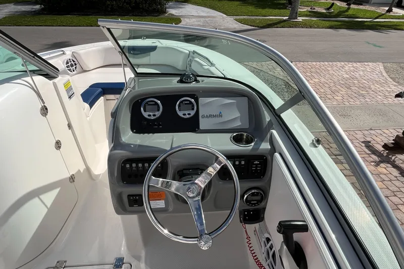 Slide: The Image of 2021 Robalo 207R boat dashboard with Garmin navigation system and steering wheel. - 4