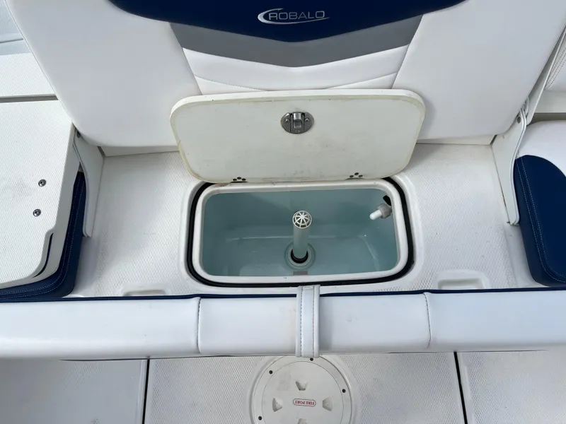 Slide: The Image of 2021 Robalo 207R boat interior with open storage compartment and seating. - 8