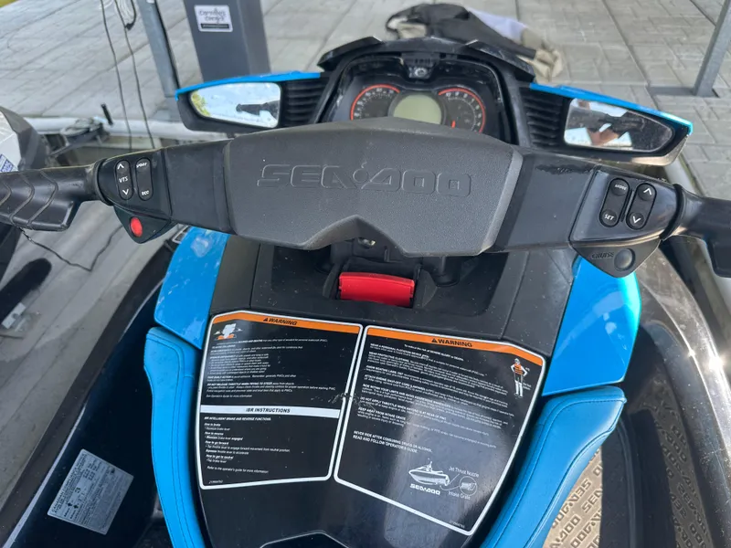 Slide: The Image of 2017 Sea-Doo RXT 260 dashboard with controls and warning labels, featuring blue accents. - 5