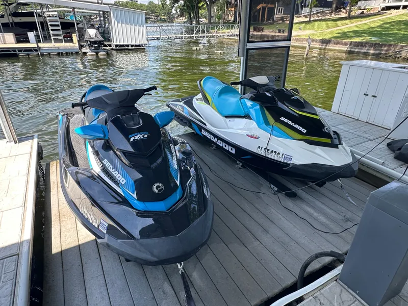 Slide: The Image of Two 2017 Sea-Doo RXT 260 jet skis docked by a lakeside pier. - 8