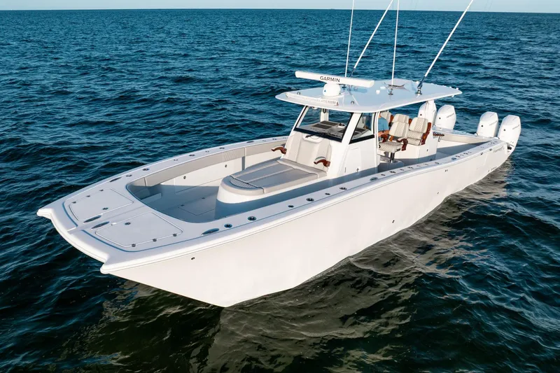 Slide: The Image of 2023 Freeman 43 boat on open water, featuring sleek design and advanced technology. - 1