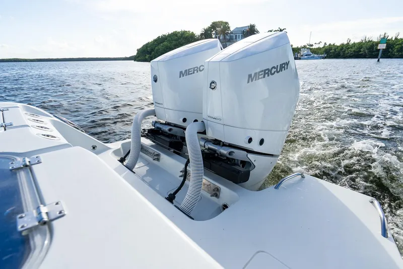 Slide: The Image of Freeman 43 boat with dual Mercury outboard engines on the water, 2023 model. - 49