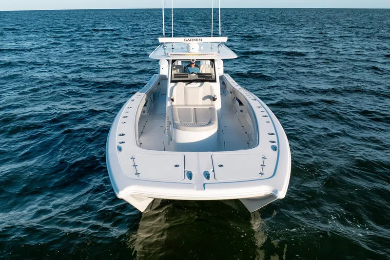 Slide: The Image of 2023 Freeman 43 boat cruising on open sea, showcasing sleek design and advanced features. - 6