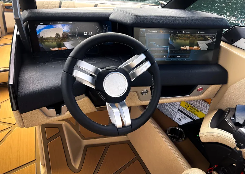 Slide: The Image of 2026 Nautique Paragon G25 dashboard with modern steering wheel and digital displays. - 14
