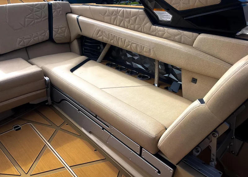 Slide: The Image of 2026 Nautique Paragon G25 interior with luxurious beige seating and geometric design. - 15