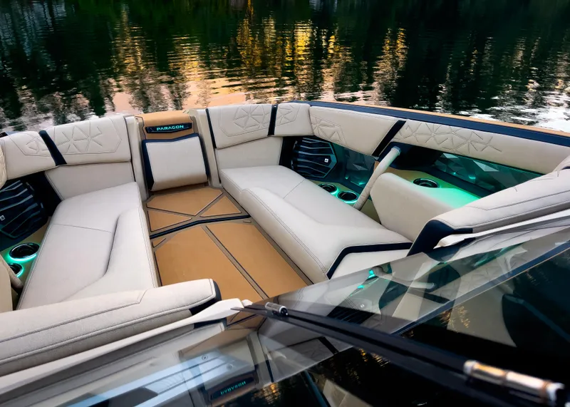 Slide: The Image of Luxurious interior of 2026 Nautique Paragon G25 boat with elegant seating and ambient lighting. - 5