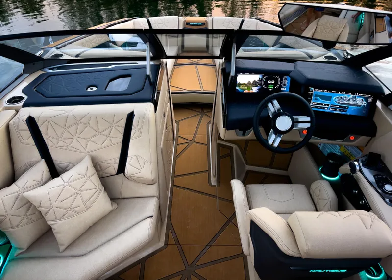 Slide: The Image of 2026 Nautique Paragon G25 interior with luxurious seating and advanced dashboard technology. - 6