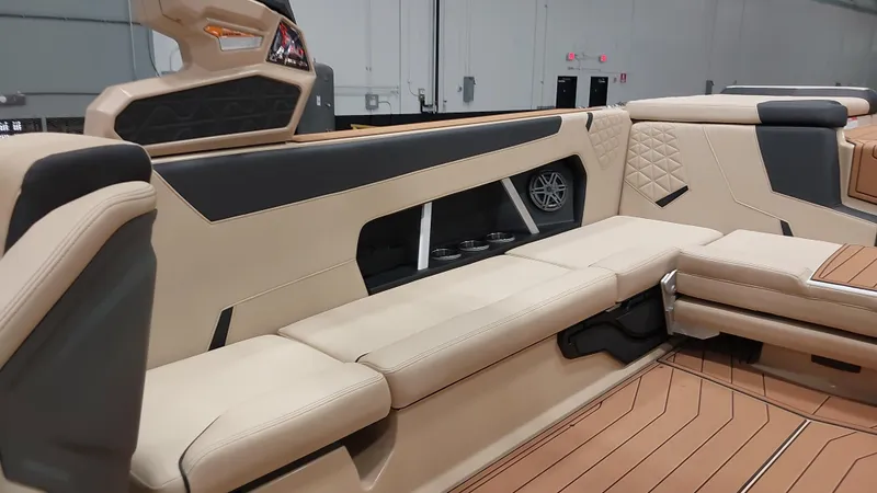 Slide: The Image of 2025 Nautique GS24 interior with beige seating and modern design elements. - 10