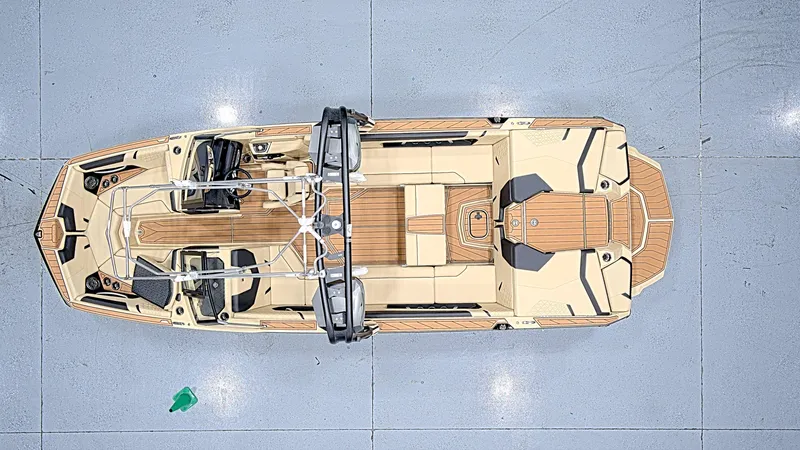 Slide: The Image of 2025 Nautique GS24 boat, top view, showcasing sleek design and spacious interior. - 3