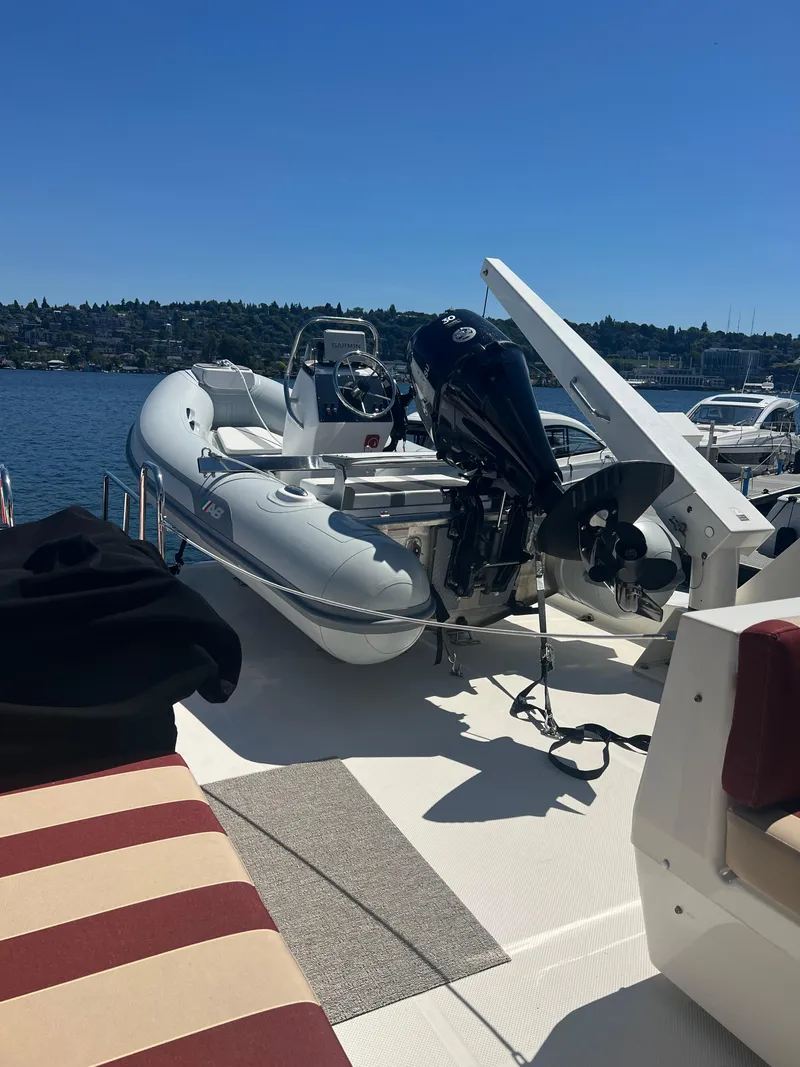 Slide: The Image of 2005 Meridian 490 Pilothouse with dinghy on deck. - 2