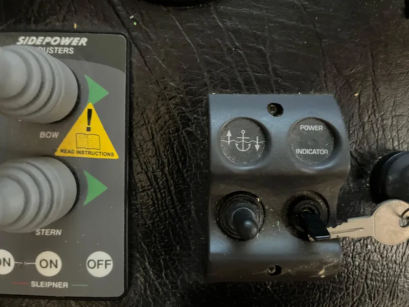 Slide: The Image of Control panel with Sidepower thrusters, key ignition, and power indicator on a Majestic 90 X 18. - 11