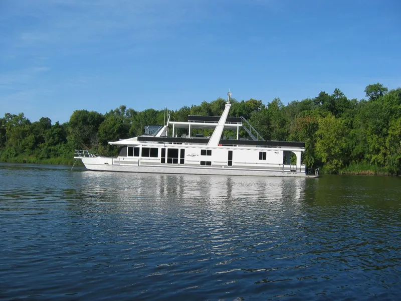 Slide: The Image of Houseboat on a serene lake, Majestic 90 X 18, 2003 model, surrounded by lush greenery. - 3