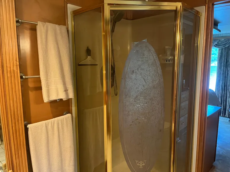 Slide: The Image of Gold-framed shower with etched glass door in a Majestic 90 X 18, 2003 model. - 40