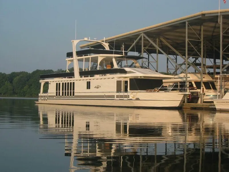 Slide: The Image of Majestic 90 X 18 houseboat docked on calm water, 2003 model. - 5
