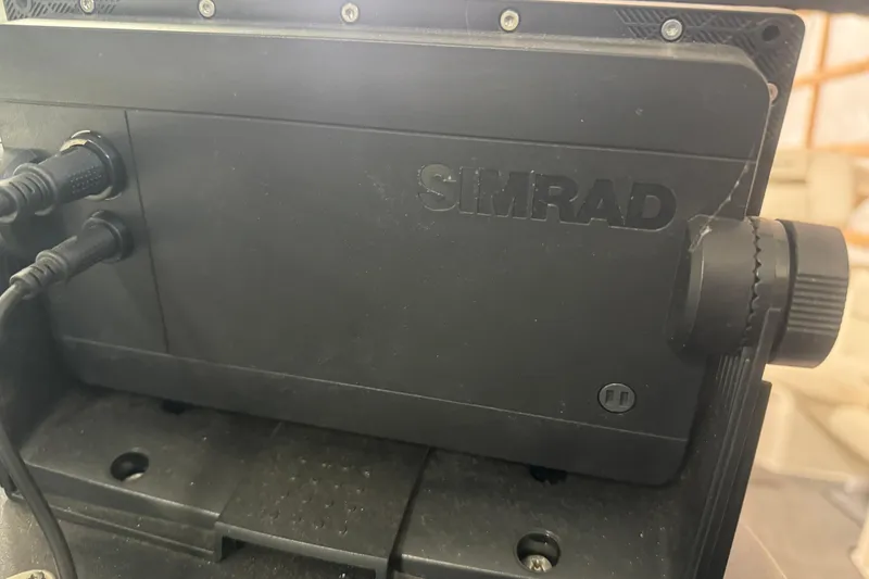 Slide: The Image of Simrad marine equipment on 2007 Sea Ray 270 SLX boat dashboard. - 35