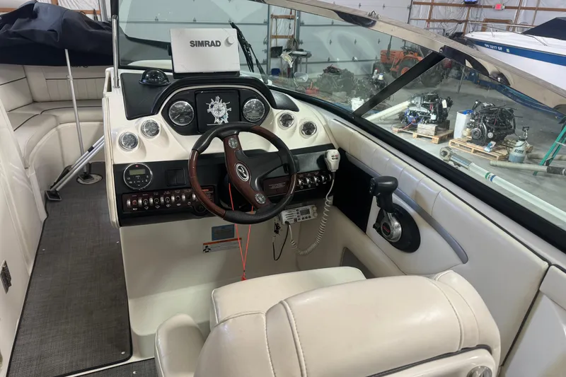 Slide: The Image of 2007 Sea Ray 270 SLX boat interior with steering wheel and control panel. - 9