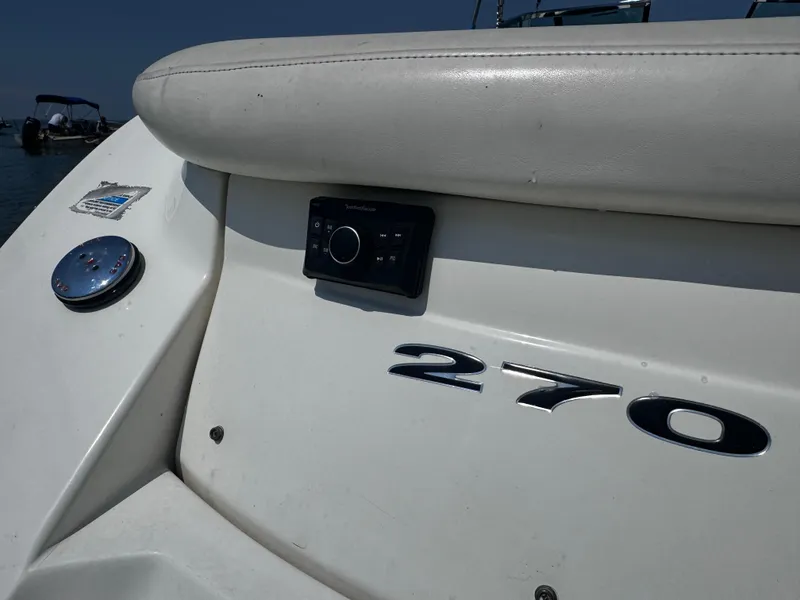 Slide: The Image of 2007 Sea Ray 270 SLX boat with control panel and logo detail. - 28